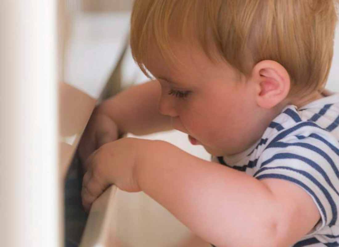 toddler looking into a drawer