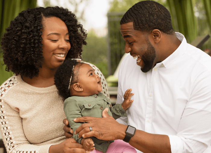 Parents and Child Smiling Together