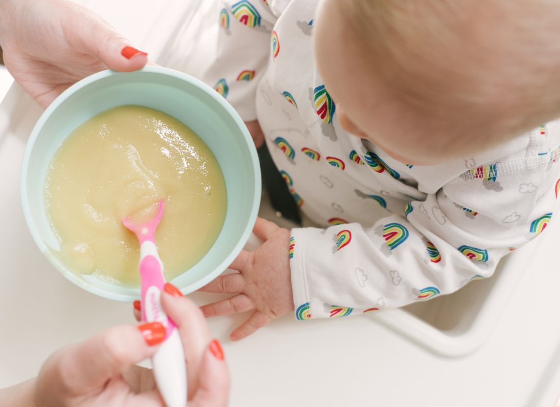 Child being fed a pureee