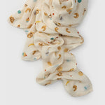 Folded French Breakfast Muslin Swaddle on a white background
