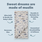 Smiley Sharks Muslin swaddle on a light blue background with text about muslin fabric.