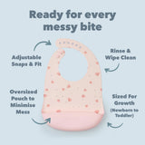 Sea Shells Silicone bib on a light blue background, featuring text about its features.