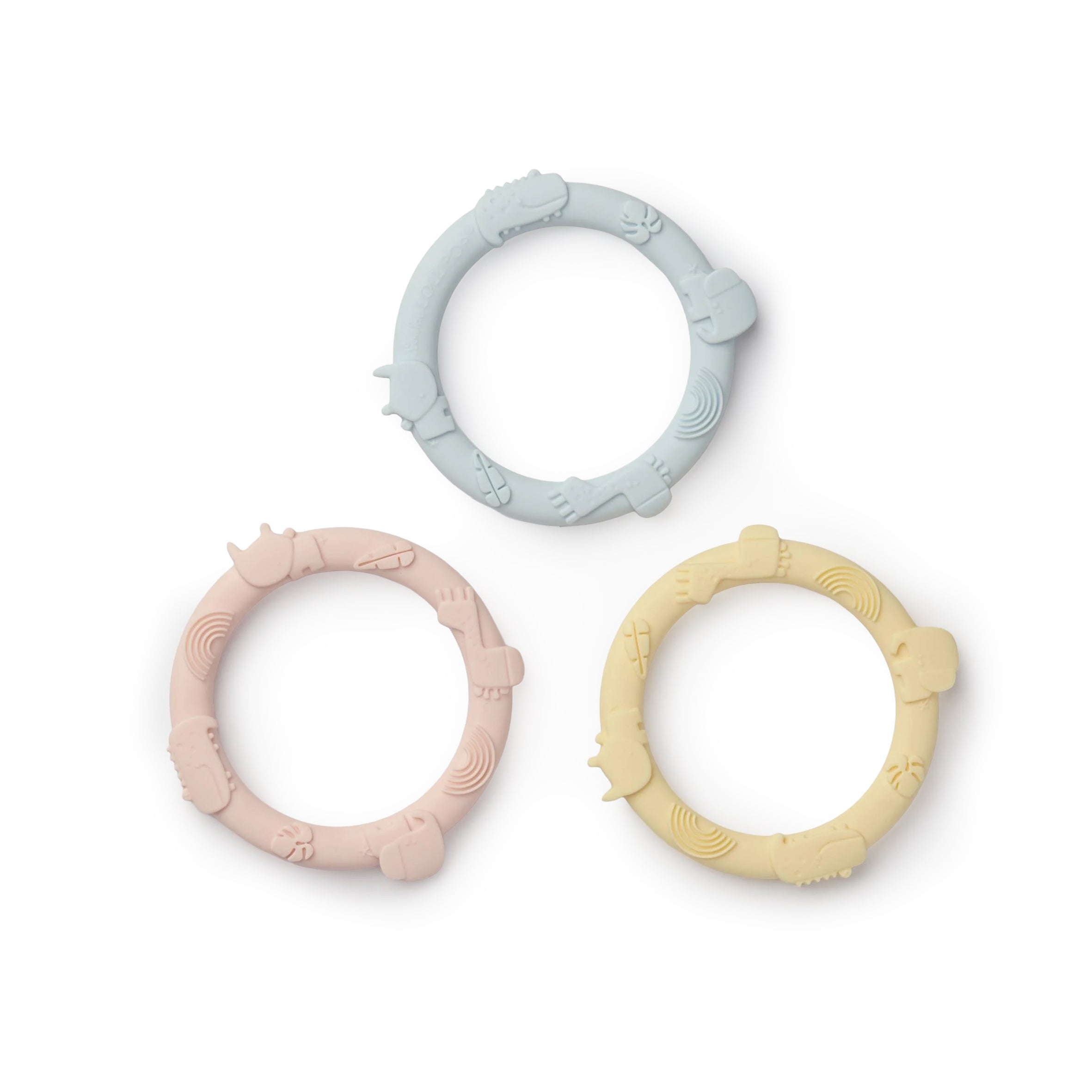 Three silicone teething rings in pastel colors on a white background