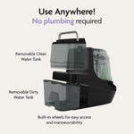 The Baby Brezza Bottle Washer Pro® - All Black is a compact, automatic bottle cleaner with labeled removable clean and dirty water tanks, built-in wheels, and “Use Anywhere! No plumbing required” text on a light background.