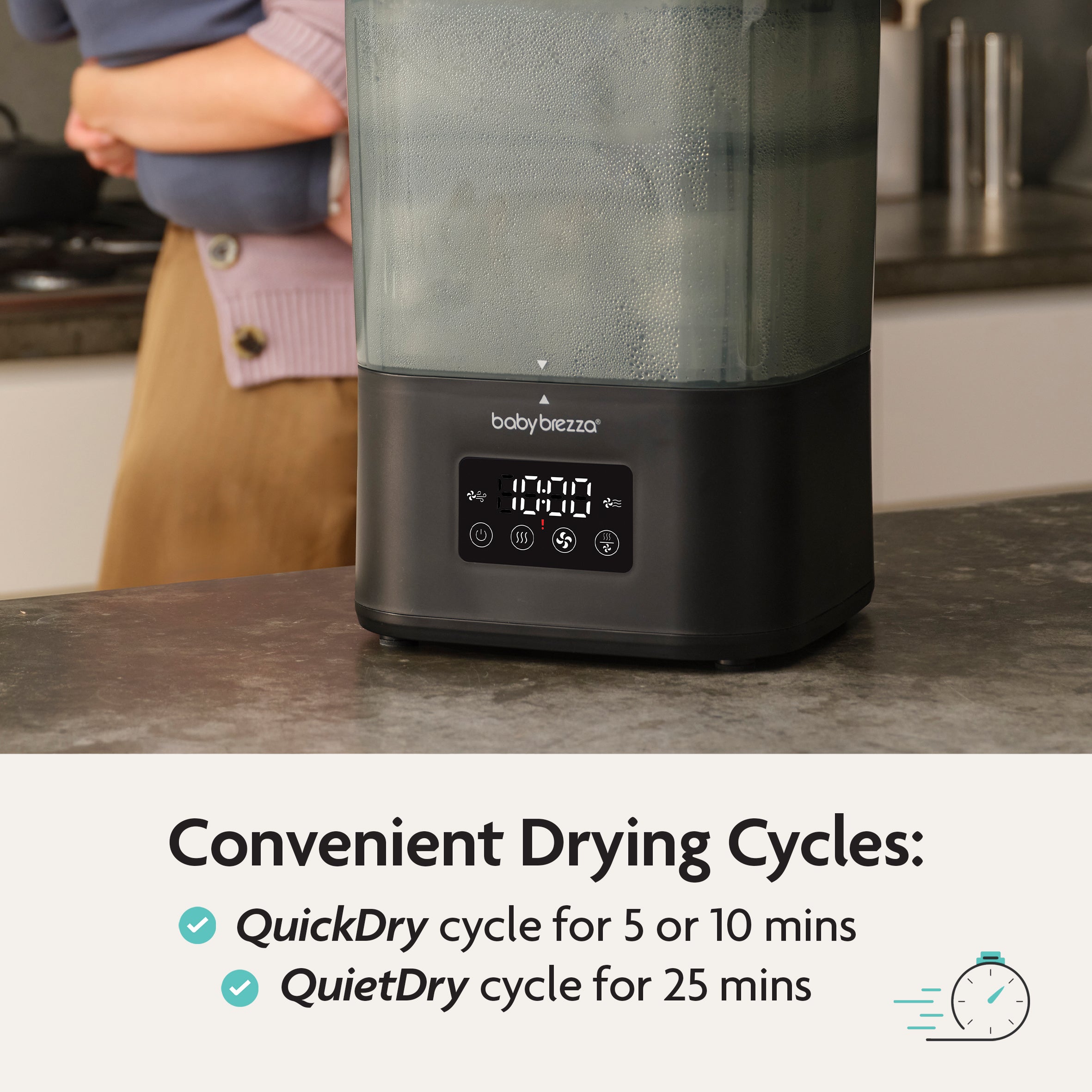 A person uses a Baby Brezza SuperQuick Steriliser Dryer on the kitchen counter. The display shows drying settings. Text: “Convenient Drying Cycles—QuickDry (5 & 10 mins), QuietDry (25 mins)” with checkmarks and a clock icon.