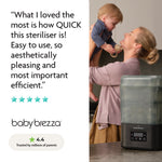 A smiling woman holds a toddler in a kitchen next to the Baby Brezza SuperQuick Steriliser Dryer. On the left, a review praises its speed, ease, and efficiency. Five stars and a 4.4 rating are shown below.