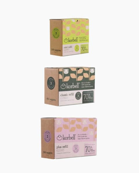 Three boxes of Korbell Nappy Bin Replacement Liners – Pack of 3, by Korbell, stacked vertically against a white background. Each box features a distinct color label and highlights 70% recycled plastic content. Designed for the Korbell Nappy Bin, these replacement liners offer a convenient continuous liner system for easy changing.