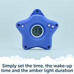 A blue, star-shaped sleep clock from Rockit called “Rising Star - The rewarding sleep clock,” displays 7:16 on its digital screen. Text below explains: Simply set the time, wake-up time, and amber light duration—making it the ideal children’s wake up clock that can be used as part of a reward system for kids.