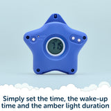 A blue, star-shaped sleep clock from Rockit called “Rising Star - The rewarding sleep clock,” displays 7:16 on its digital screen. Text below explains: Simply set the time, wake-up time, and amber light duration—making it the ideal children’s wake up clock that can be used as part of a reward system for kids.